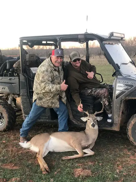 Veterans and volunteers sharing a candid moment during a ranch outing